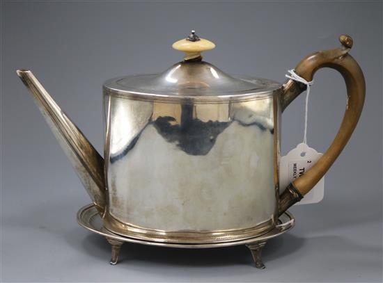 A George III silver teapot with associated stand, gross 19.5 oz.